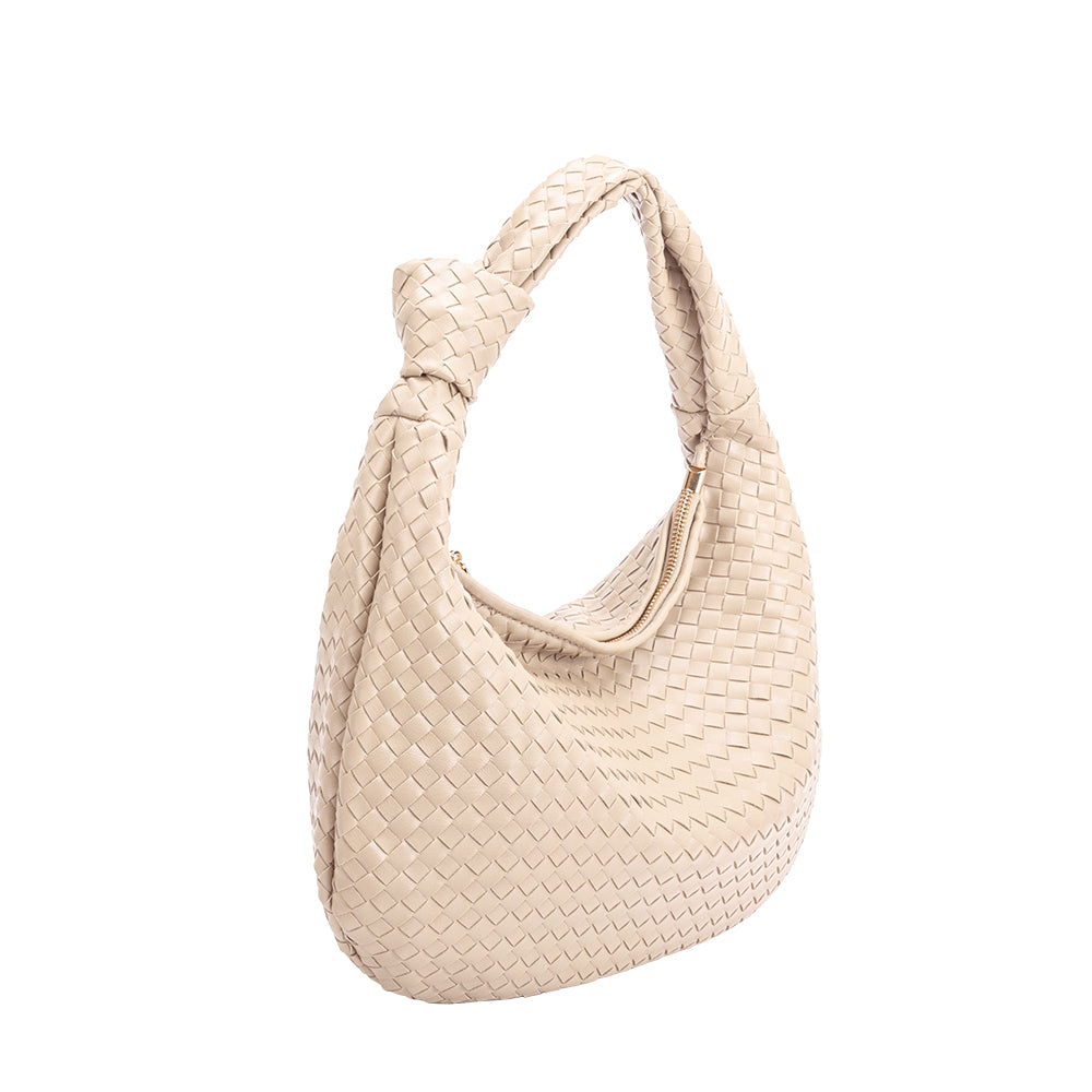 A ivory recycled vegan leather shoulder bag with a knot. 