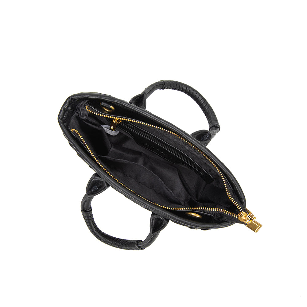 A small black recycled vegan leather crossbody bag with a wrapped handle. 