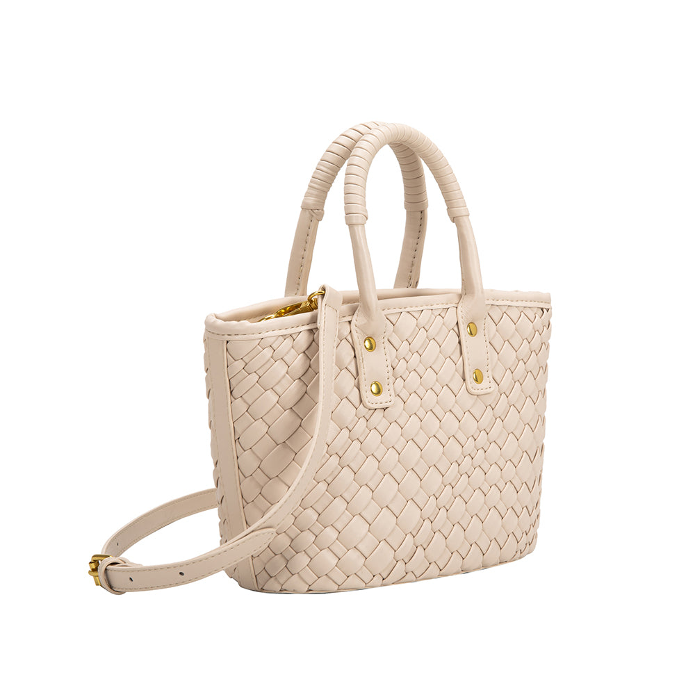 A small bone woven vegan leather crossbody bag with a wrapped handle. 