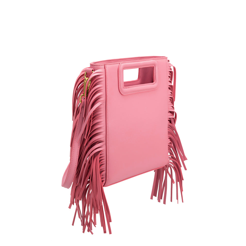 A square structured pink vegan leather crossbody bag with fringe on the side. 