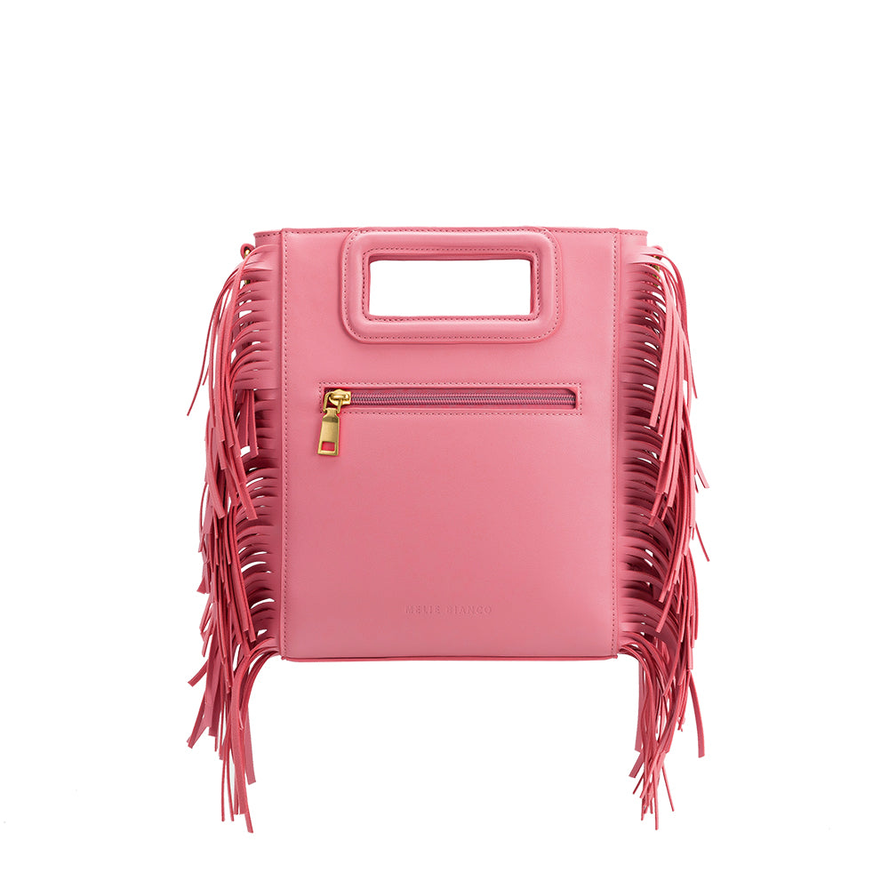 A square structured pink vegan leather crossbody bag with fringe on the side. 