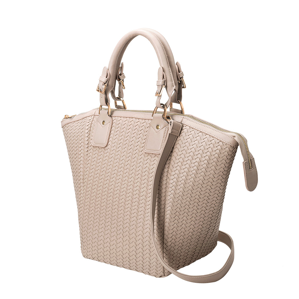 A large nude hand woven vegan leather tote bag.