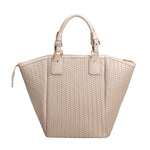 A large nude hand woven vegan leather tote bag.
