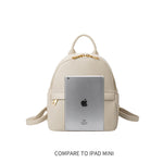An Ipad mini size comparison image for a recycled vegan leather backpack with a front zip pocket. 