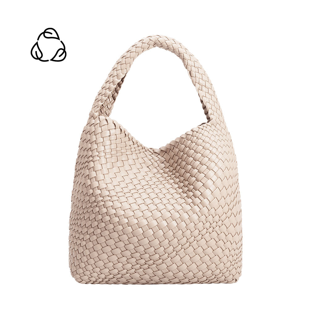 A large ivory woven vegan leather shoulder bag.