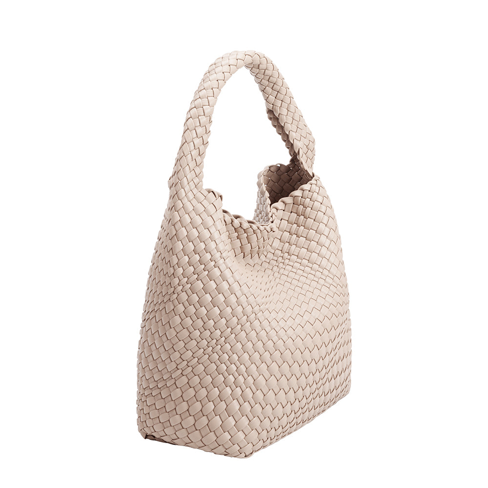 A large ivory woven vegan leather shoulder bag.