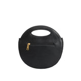 A black circle vegan leather crossbody bag with woven pattern.