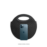 An iphone 12 pro size comparison image for a circle shaped vegan leather crossbody bag with woven pattern.