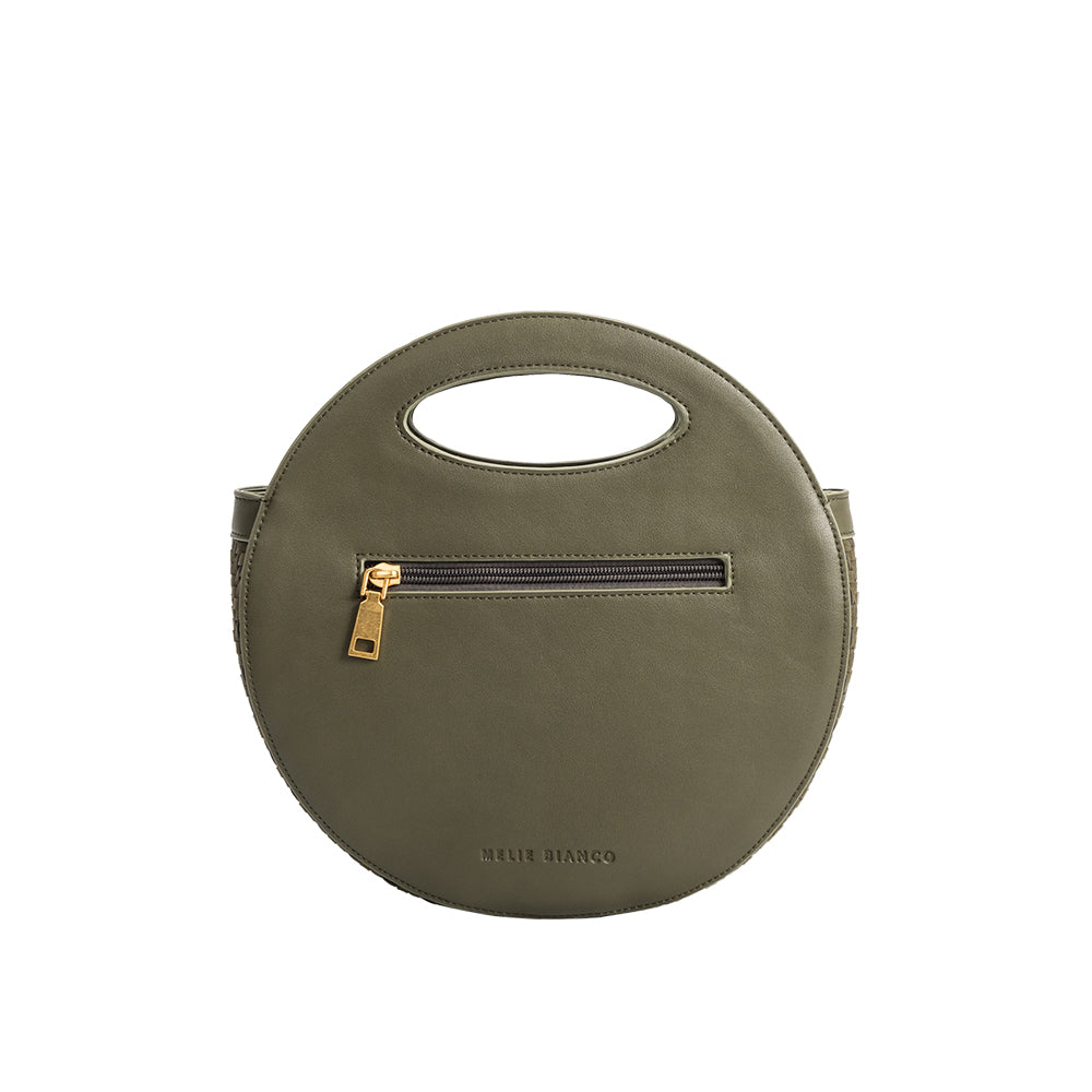 A olive circle vegan leather crossbody bag with woven pattern.