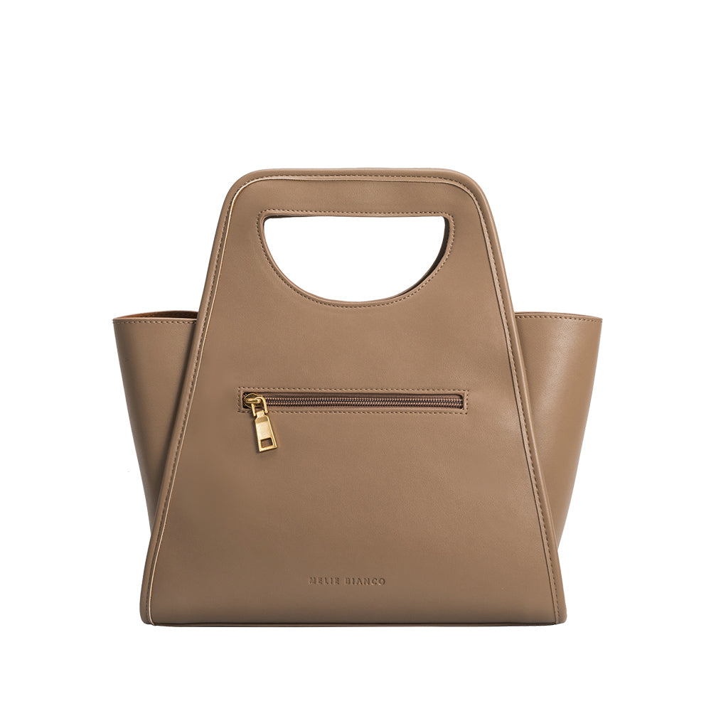 A taupe square shaped recycled vegan leather top handle bag. 