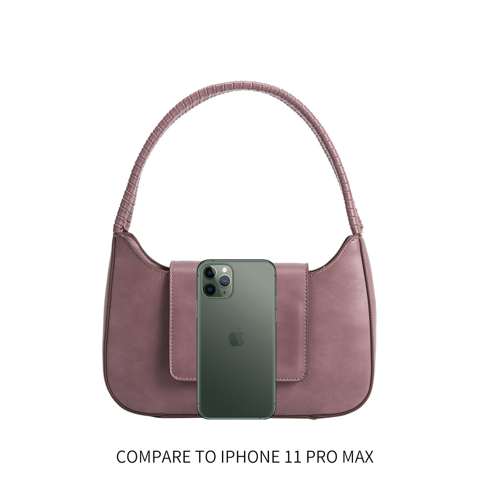 an iphone 11 size comparison image for a small vegan leather shoulder bag with a wrapped handle. 