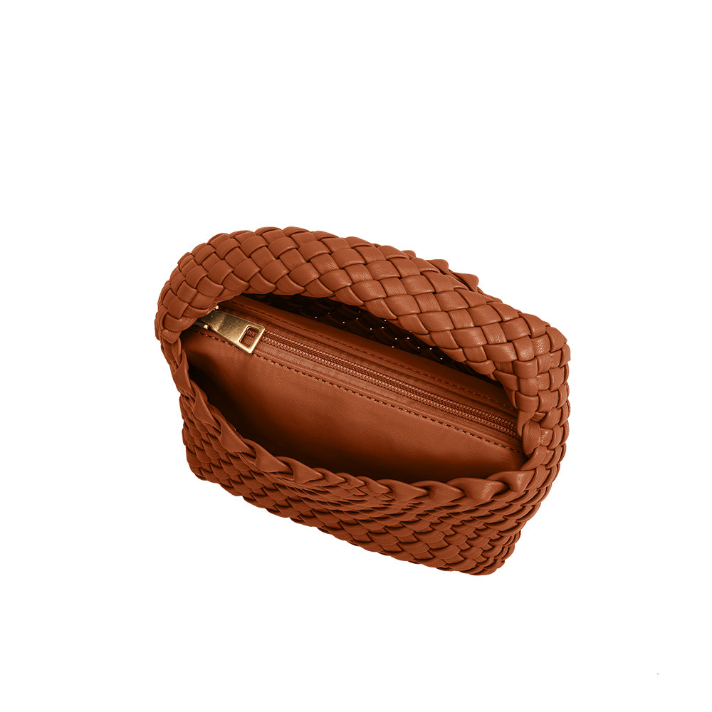 A small saddle hand woven vegan leather top handle bag with a zip pouch.