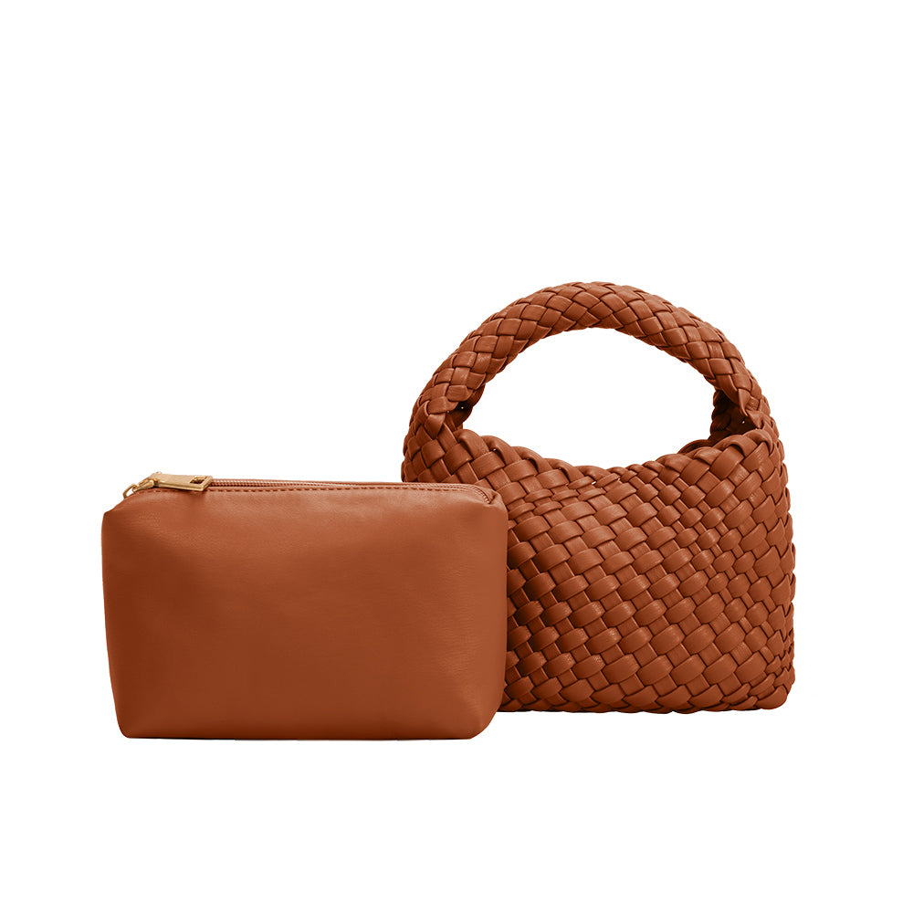 A small hand woven vegan leather top handle bag with a zip pouch.