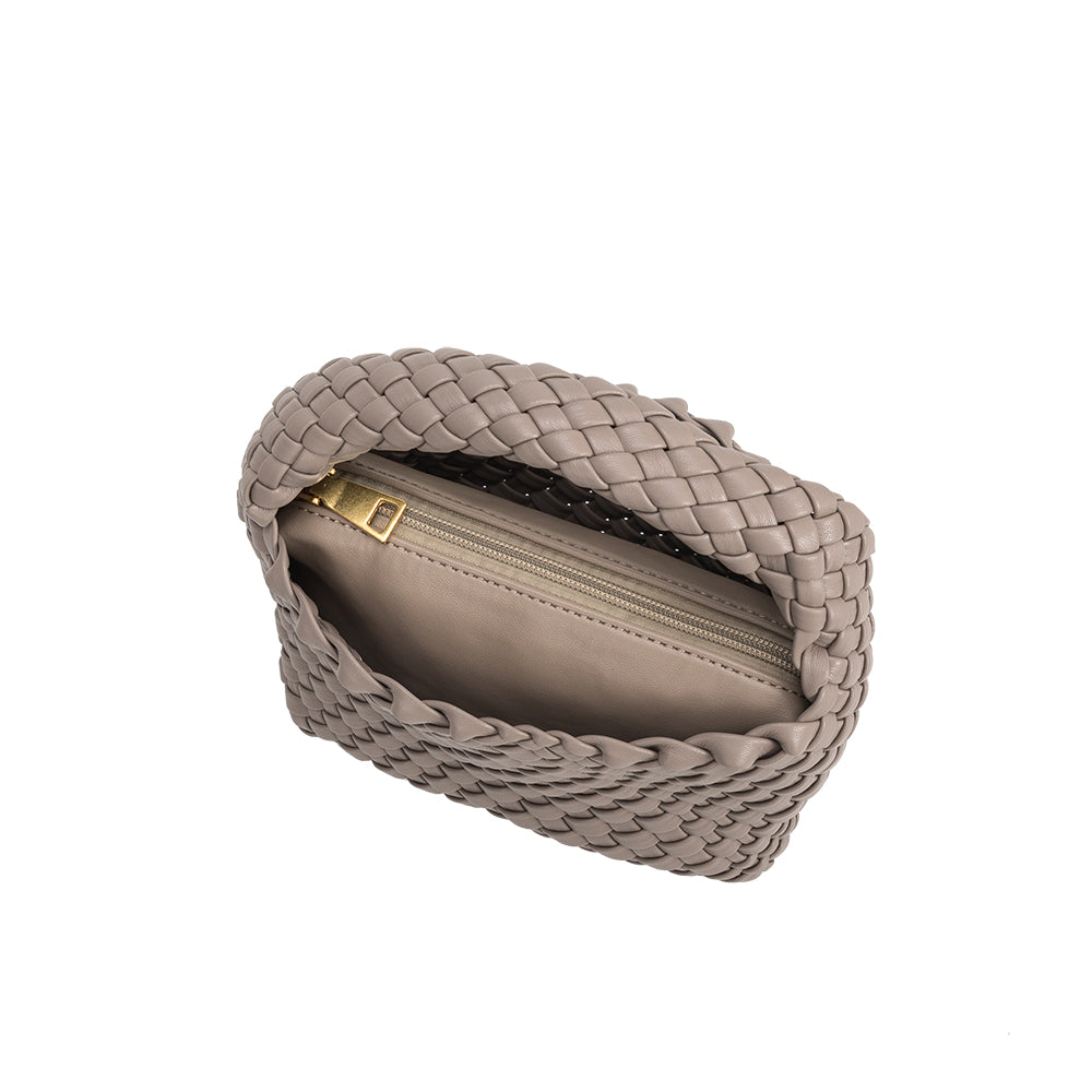 A small taupe hand woven vegan leather top handle bag with a zip pouch inside. 