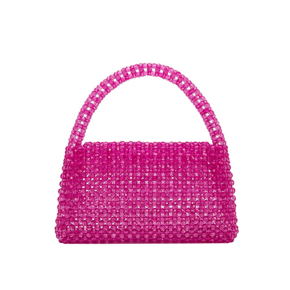 A small fuchsia crystal beaded top handle bag with a flap closure. 