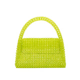 A small lime crystal beaded top handle bag with a closure flap.