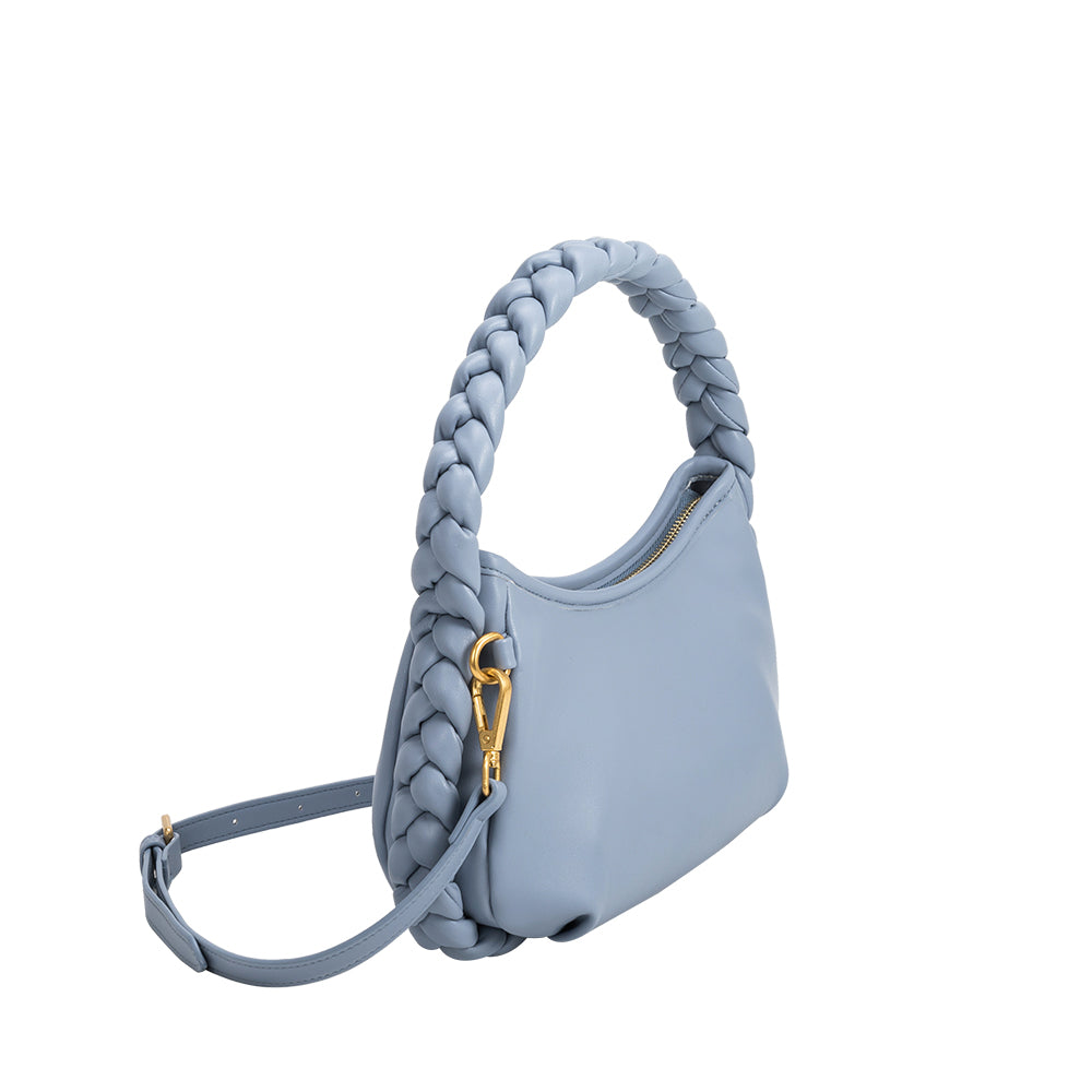A small blue recycled vegan leather shoulder bag with a braided handle.