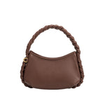 A small chocolate recycled vegan leather shoulder bag with a braided handle.