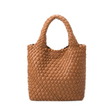 A small saddle woven recycled vegan leather tote bag with double handle.