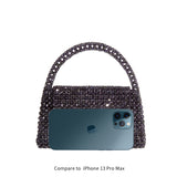 An iphone 13 pro size comparison image for a crystal beaded top handle bag with a flap closure. 