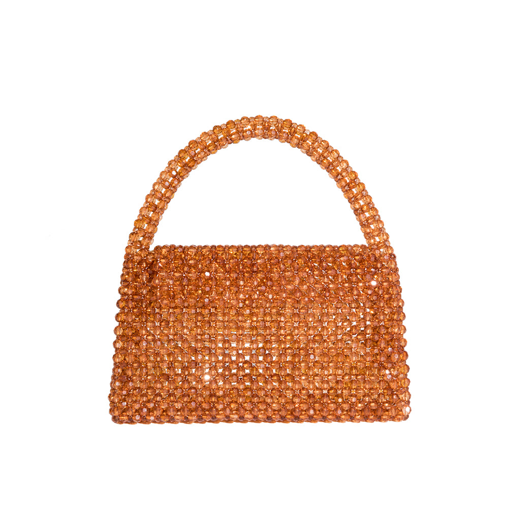 A small topaz crystal beaded top handle bag with a flap closure. 