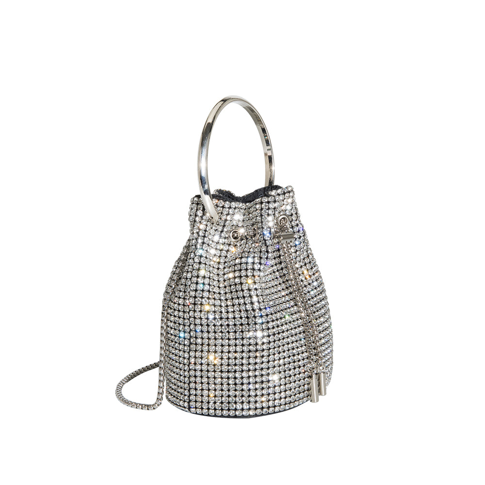 A small silver crystal drawstring ring top handle bag.