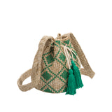A small green straw drawstring crossbody bag with green pompoms.