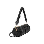 A medium black cylindrical-shaped shoulder bag with a ruched body and strap. 