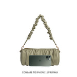 An iphone11 pro size comparison image for a medium cylindrical-shaped shoulder bag with ruched body and strap.