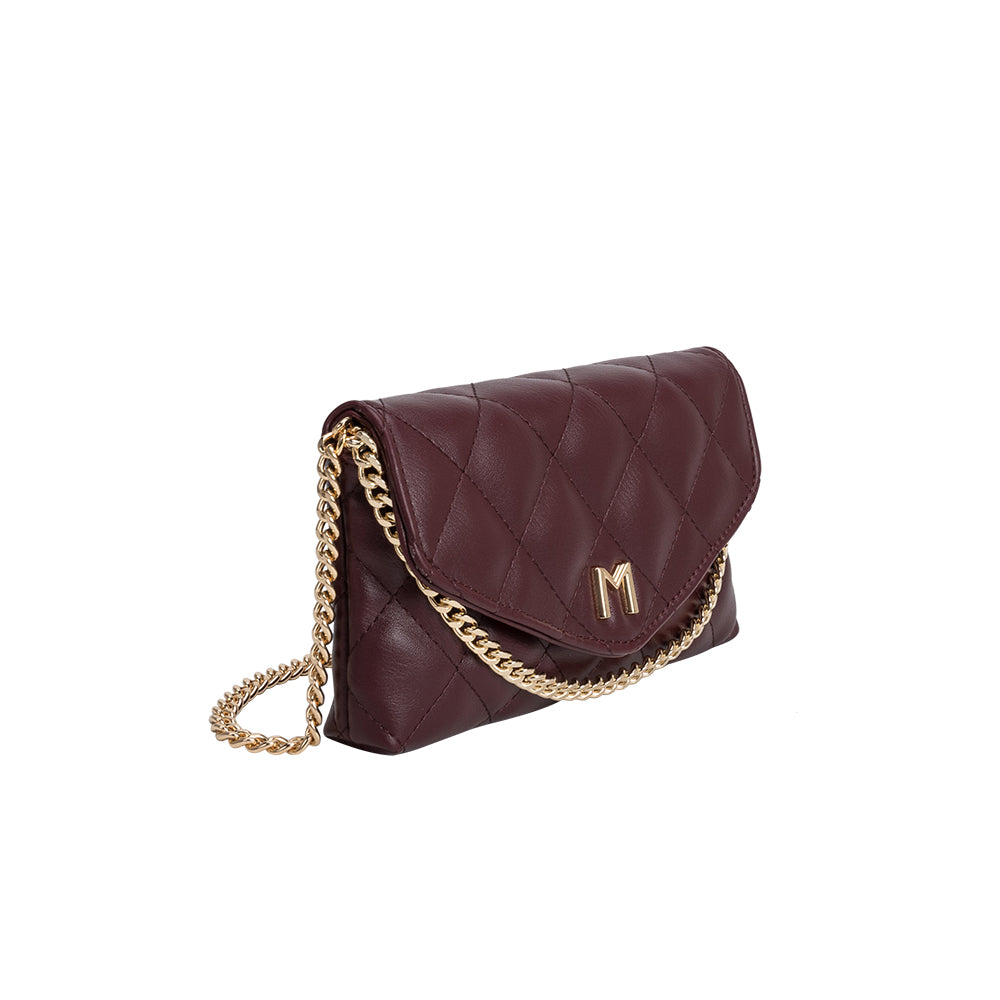 A small burgundy quilted vegan leather shoulder bag with a gold M hardware. 