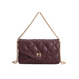 A small burgundy quilted vegan leather shoulder bag with gold M hardware. 