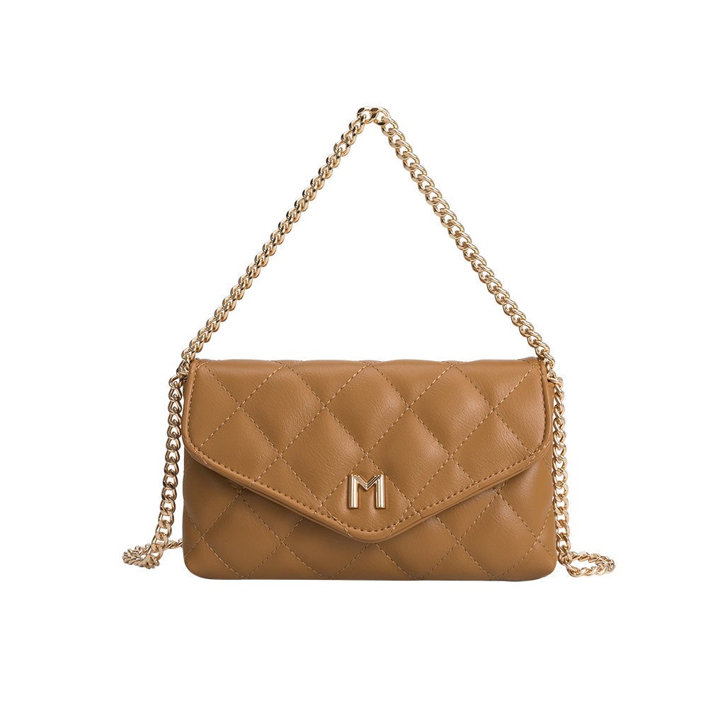 A small camel quilted vegan leather shoulder bag with gold M hardware. 