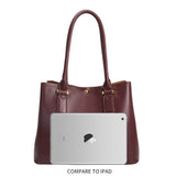 An ipad size comparison for a large vegan leather shoulder bag with gold hardware. 