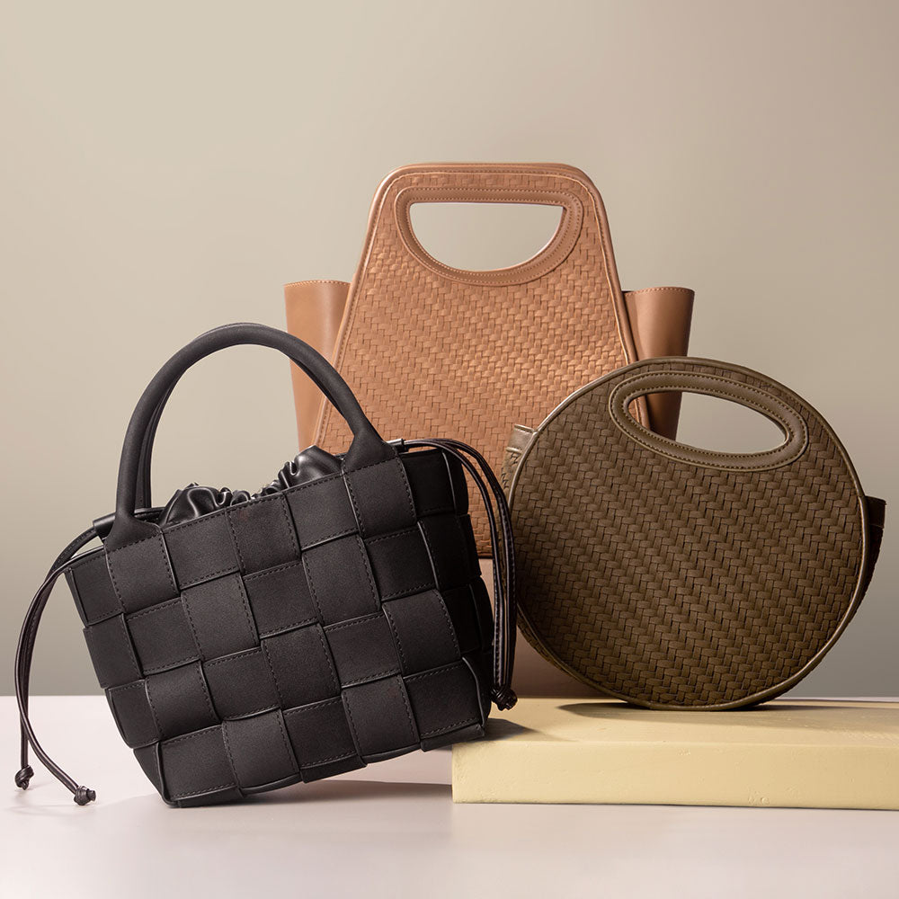 A still image of three woven pattern vegan leather crossbody bags against a brown background.