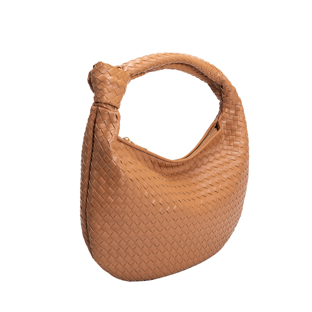 A caramel recycled vegan leather shoulder handbag with a knot. 