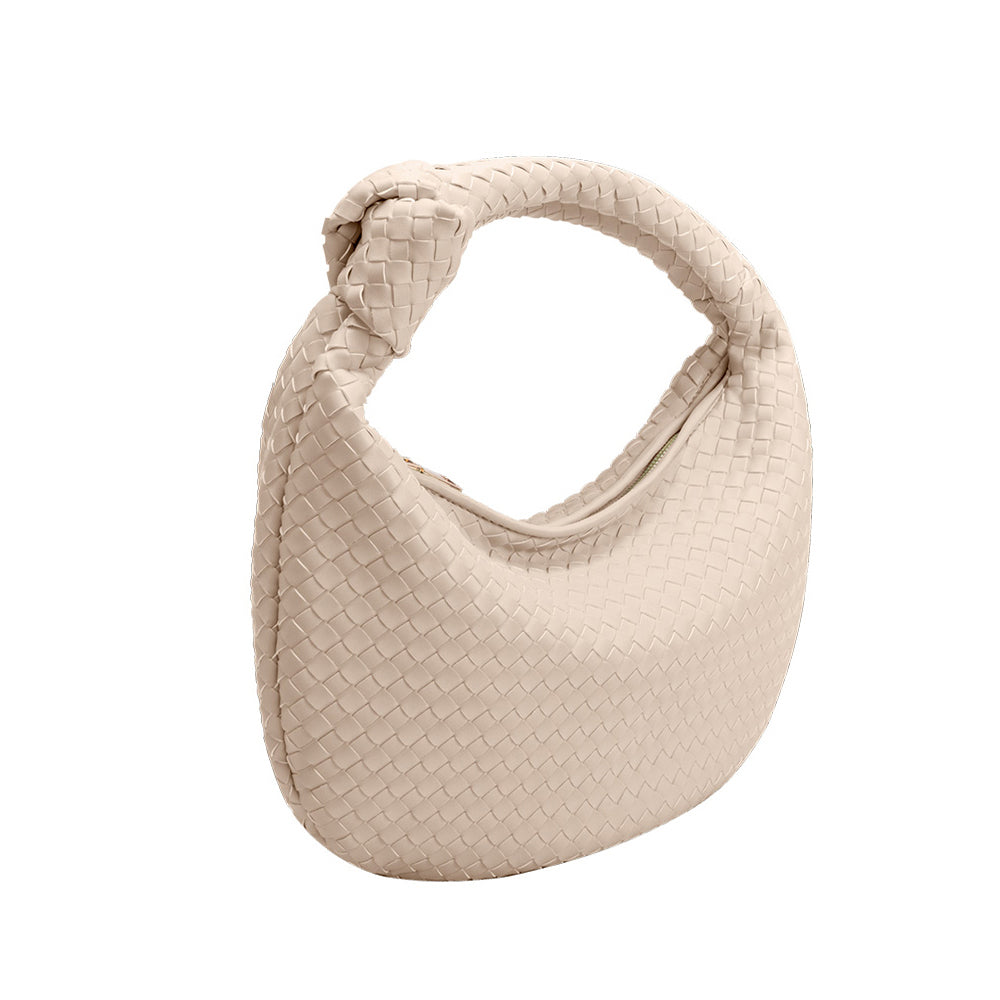 A bone recycled vegan leather shoulder bag with a knot. 