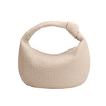 A bone recycled vegan leather shoulder bag with a knot. 
