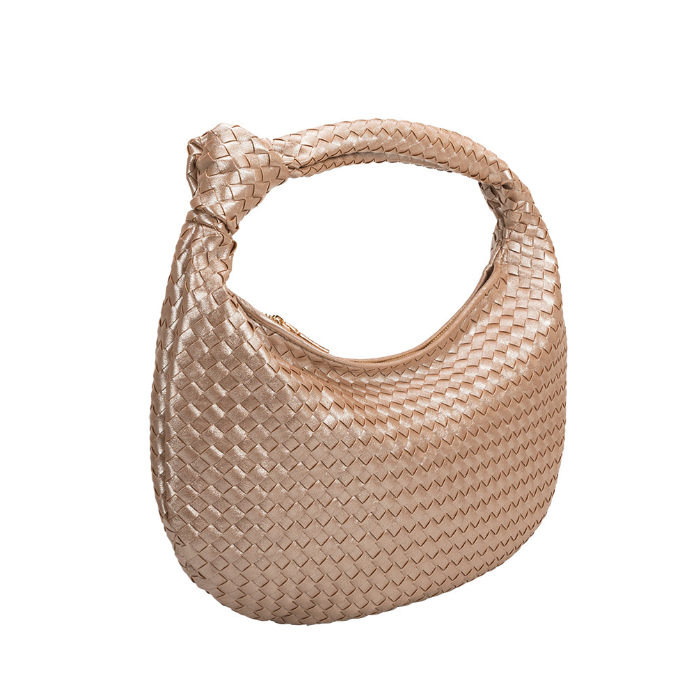 A champagne recycled vegan leather handbag with a knot. 