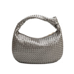 A pewter metallic recycled vegan leather shoulder bag with a knot. 