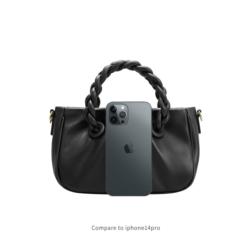 An iphone 14 pro size comparison image for a small recycled vegan leather crossbody bag with twisted handle. 