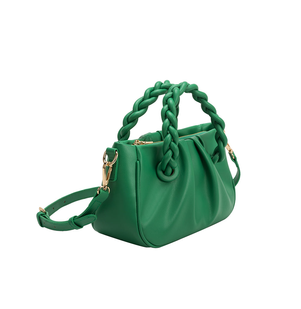 A small green recycled vegan leather crossbody bag with twisted handle. 