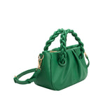 A small green recycled vegan leather crossbody bag with twisted handle. 