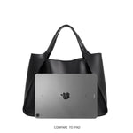 An Ipad size comparison image for a large recycled vegan leather tote bag with a wrapped handle. 