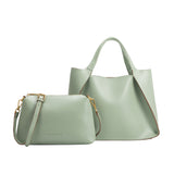 A large mint recycled vegan leather tote bag with a zip pouch.