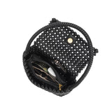An inside view image for a small crocheted vegan leather shoulder bag with a phone, makeup, and wallet inside. 