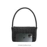 An iphone 14 pro size comparison image for a small crocheted recycled vegan leather shoulder bag.