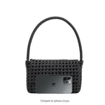 An iphone 14 pro size comparison image for a crocheted vegan leather shoulder bag.
