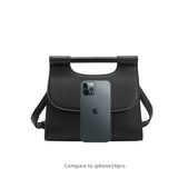 An iphone 14 size comparison image for a small square structured vegan leather crossbody bag with a wooden handle. 